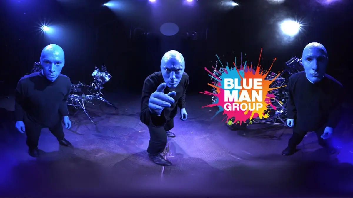 Blue Man Group performing with lights and colourful liquids in Berlin