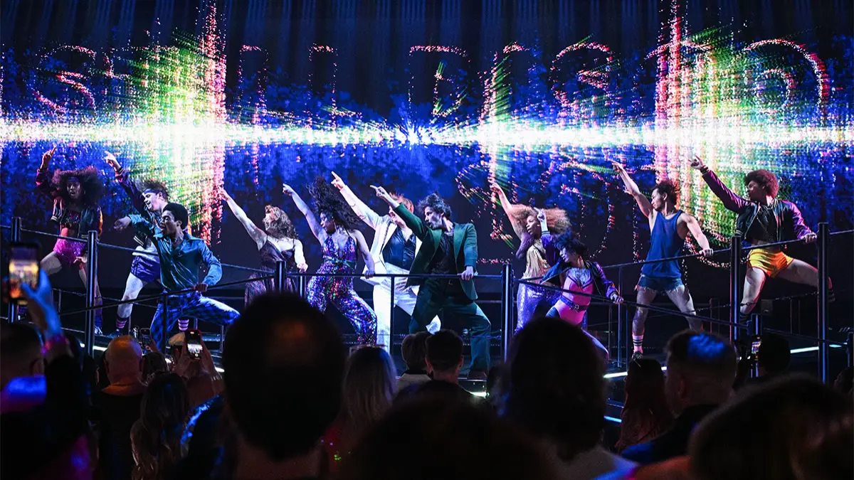 Dancers in a disco finger pose for DiscoShow, Vegas