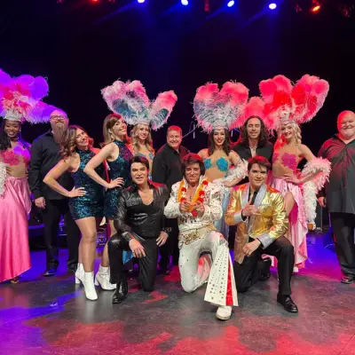 Elvis impersonator and dancers pose for a photo at the Alexis Park Resort Hotel