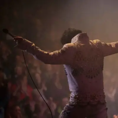 Elvis impersonator on stage posing