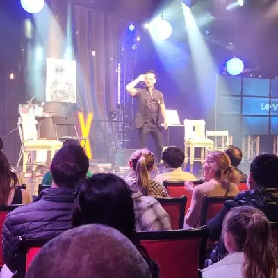 Da Silva stands on stage at Paranormal show Las Vegas