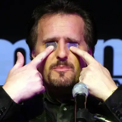 McCambridge with coins in his eyes at the Mentalist show