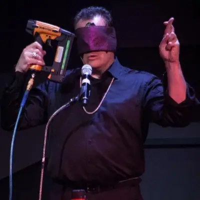 Gerry performing a trick at The Mentalist show