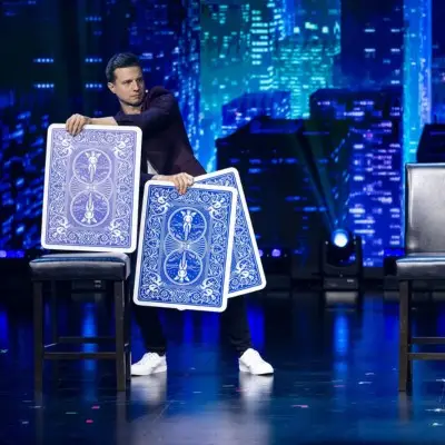 Mat Franco performing with big cards