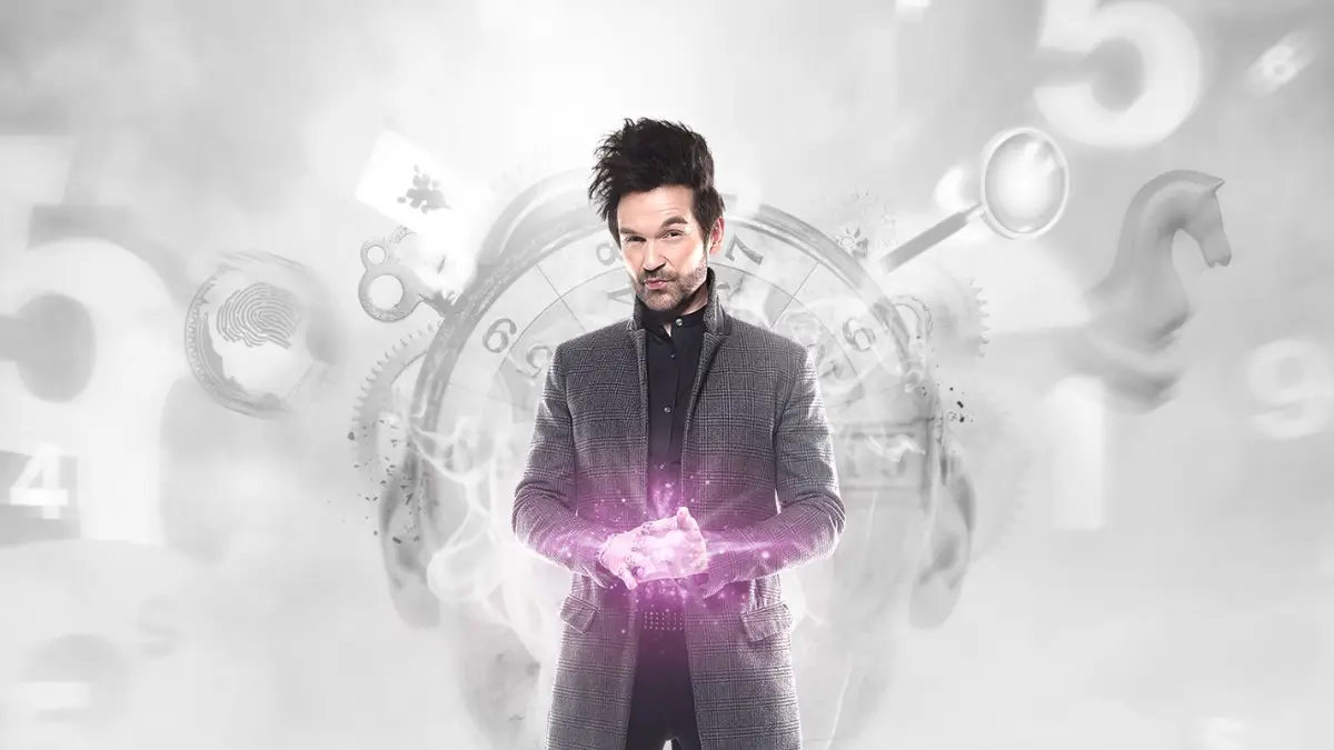 The Colin Cloud show poster, in which he stands wearing a grey coat