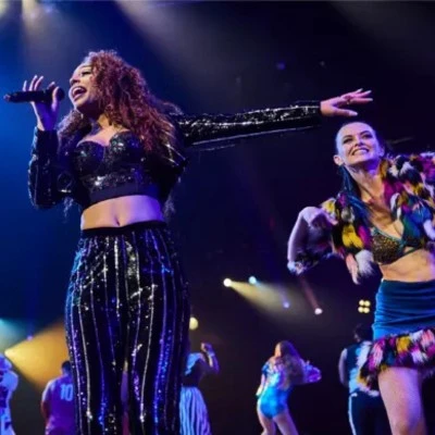 Female lead performing at the Mad Apple show by Cirque du soleil