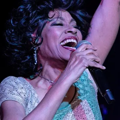A singer from Musical Journey with James Brown & Motown performing at the Ahern Hotel