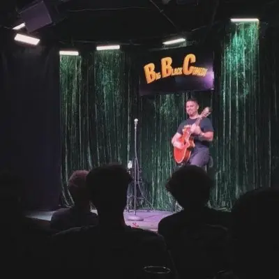 An artist looking at the audience while performing