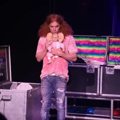 Carrot Top holding a doll for the show in Las Vegas