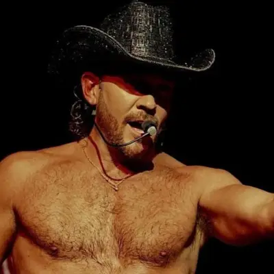 Chase Brown pointing at the audience while performing