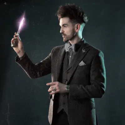 Colin Cloud with a looking glass in his hands
