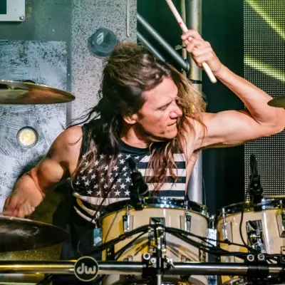 An artist playing the drums at Raiding the Rock Vault