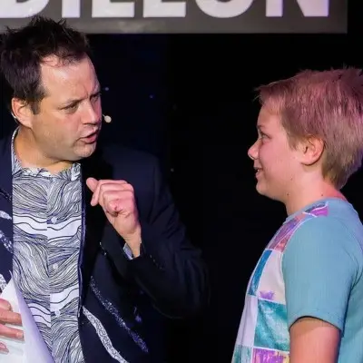 Farrell Dillon with a child at the Farrell Dillon Comedy Magic show Vegas