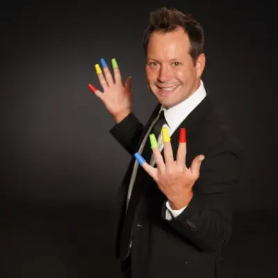 Farrell Dillon with colorful finger caps on his hands