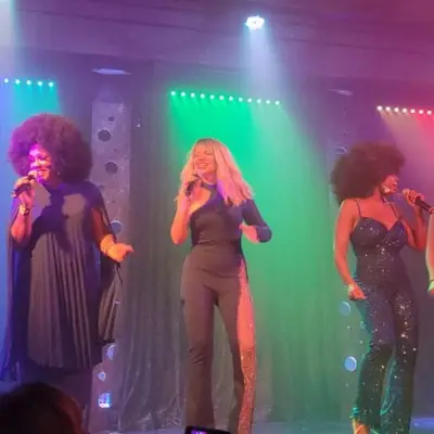 The members of the group performing on stage