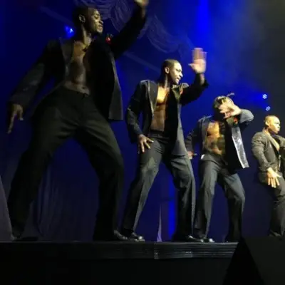 Men dancing on the stage at the Black Magic live show in Las Vegas