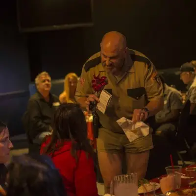 Hosts of the Marriage Can Be Murder Dinner Show Holding hands