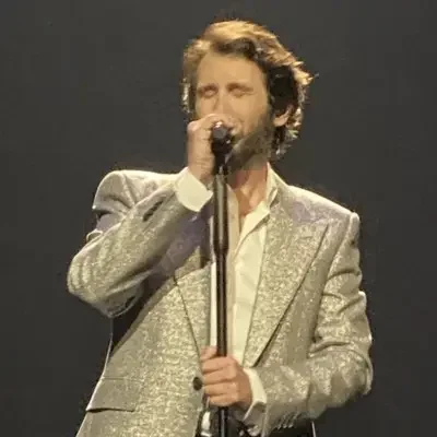 Groban performing with a glitter jacket on