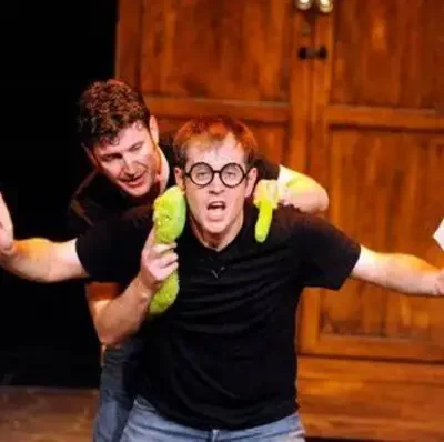Performers with wands in their hands at the Potted Potter show