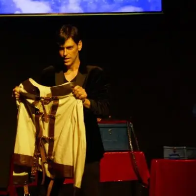 LIOZ with a jacket in his hands as props