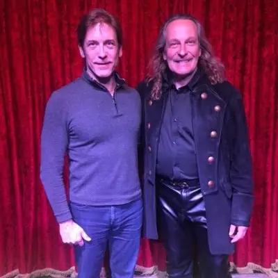 Losander posing with audience member after the Candlelight Magic Show at Vegas