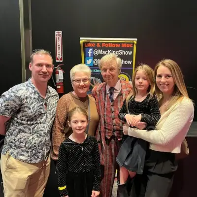 Mac King with audience members after show