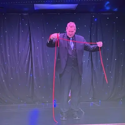 Magician performing magic with rope in the Magic of Christmas Show at Las Vegas