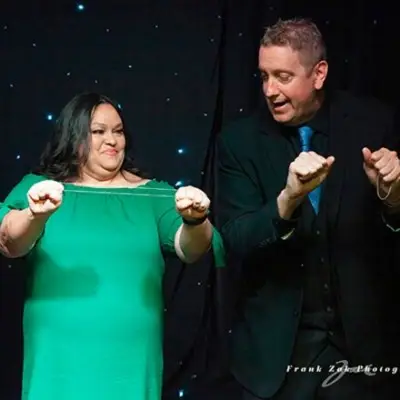 Magician performing tricks with audience member at the Masters of Magic Show