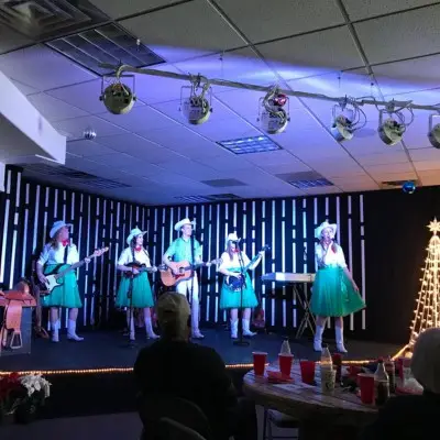 Mama’s Wranglers performing in cowboy hats and boots