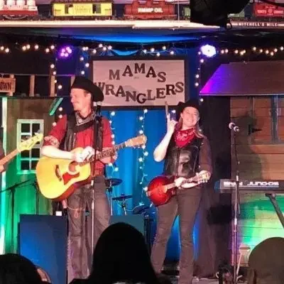 Mama’s Wranglers performing at Firelight Barn Dinner Theater