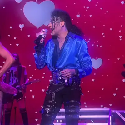 Michael Jackson impersonator singing on stage
