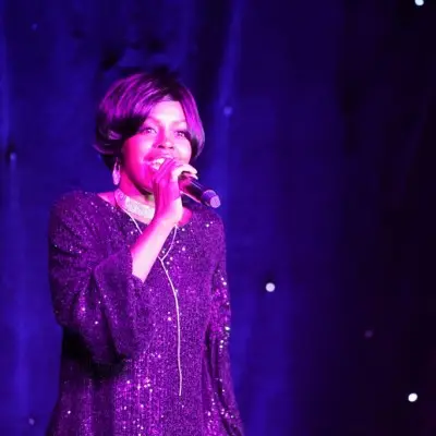 A member from Motown Brunch singing