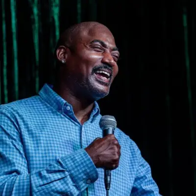Comedian laughing during his skit