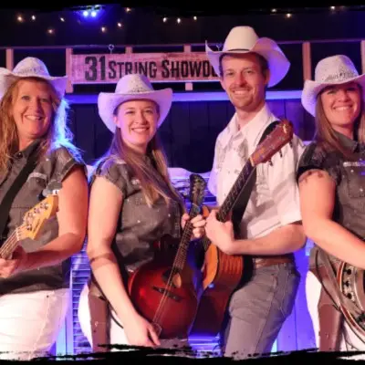 Performers posing with instruments at the 31 String Showdown