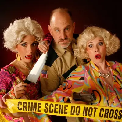 Performers posing with various props