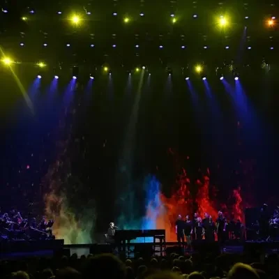 A picture of Josh Groban and choir performing in front of the audience