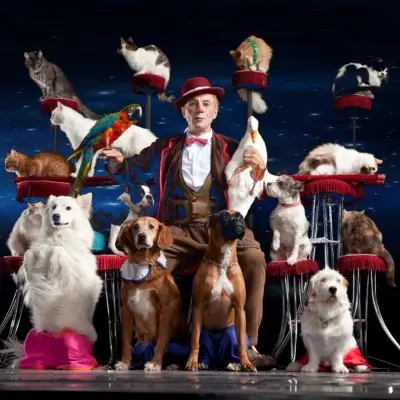 Popovich and his animals posing for Popovich Comedy Pet Theater in Vegas