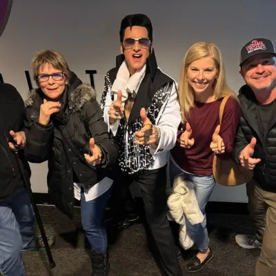 The Elvis impersonator posing with the audience in Las Vegas