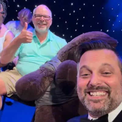 Steve Falcon posing with audience at the Comedy Hypnosis Hour show