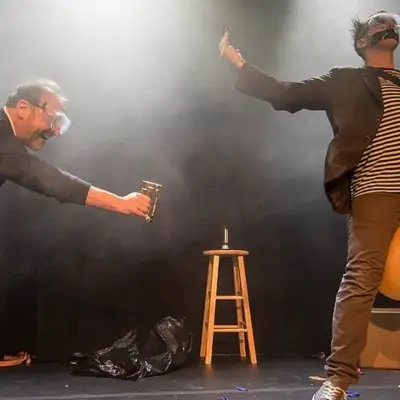 Tape Face and audience member on stage for the show in Vegas