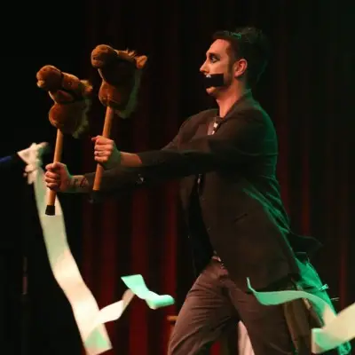 Tape Face holding horse figures for the show in Las Vegas