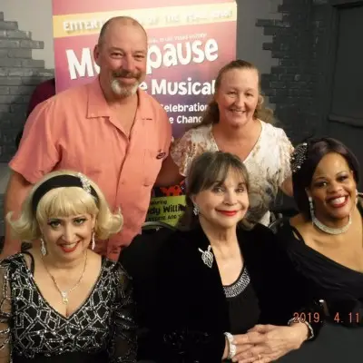 Performers making shocked expressions at Menopause the Musical The cast of Menopause the Musical taking pictures with audience after the show