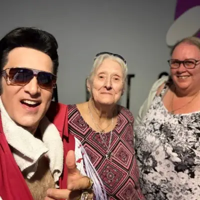 The Elvis impersonator in a selfie with audience