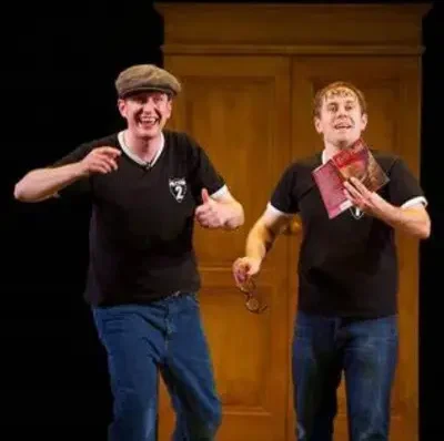 Two performers in black t-shirt at the Potted Potter show